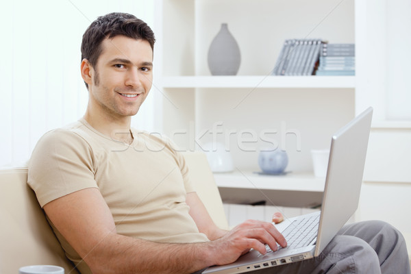 Happy man using computer Stock photo © nyul