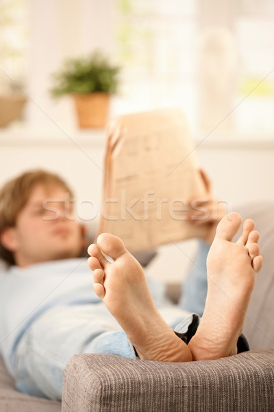 Man reading on couch Stock photo © nyul