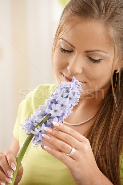 Woman smelling flowers Stock photo © nyul