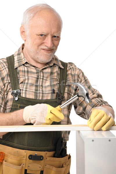 Elderly man hammering Stock photo © nyul