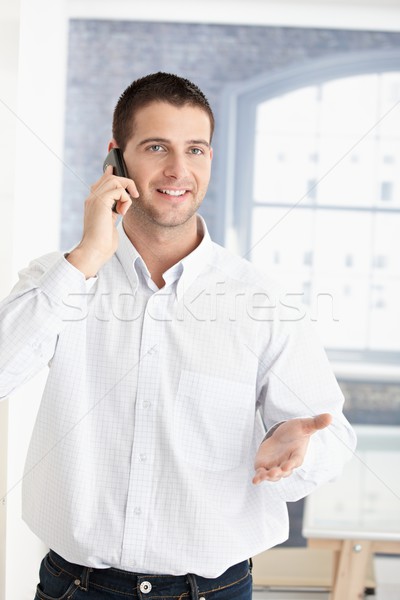 Happy young man on phone Stock photo © nyul