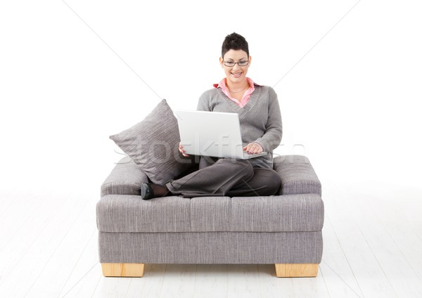 Nő dolgozik otthon fiatal nő ül kanapé Stock fotó © nyul