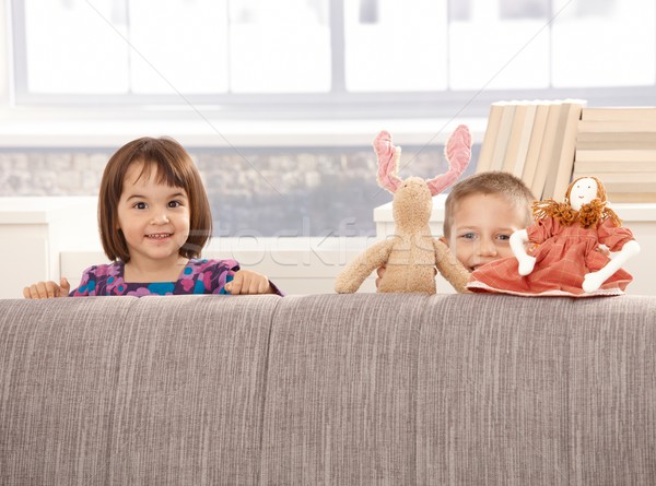 Kids standing behind sofa Stock photo © nyul