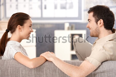 Young couple smiling happily each other at home Stock photo © nyul