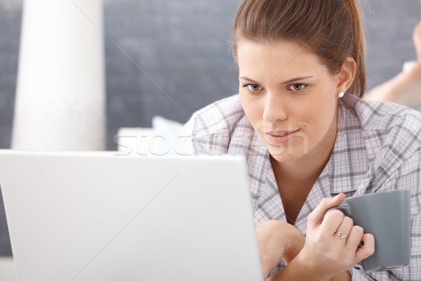 Smiling attractive woman with coffee and laptop Stock photo © nyul
