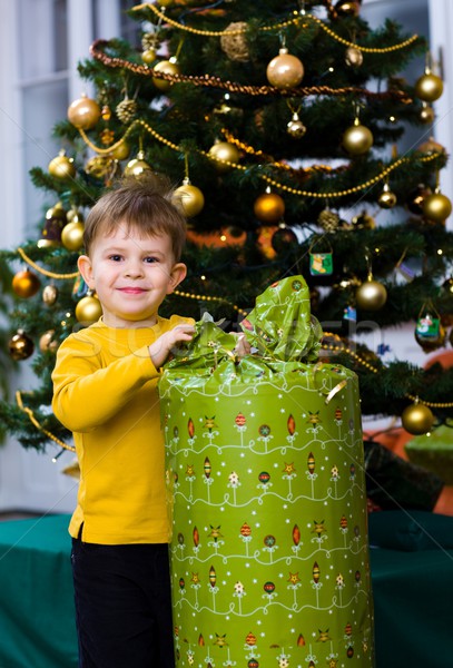 Little boy opening Chrismas present Stock photo © nyul