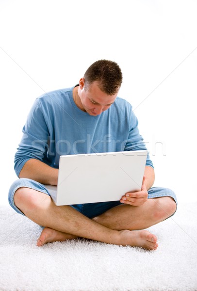  Young casual man with laptop Stock photo © nyul