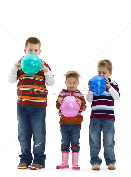 Children blowing up toy balloons Stock photo © nyul