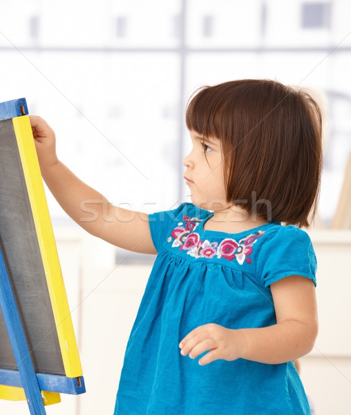 Cute little girl with drawing board Stock photo © nyul