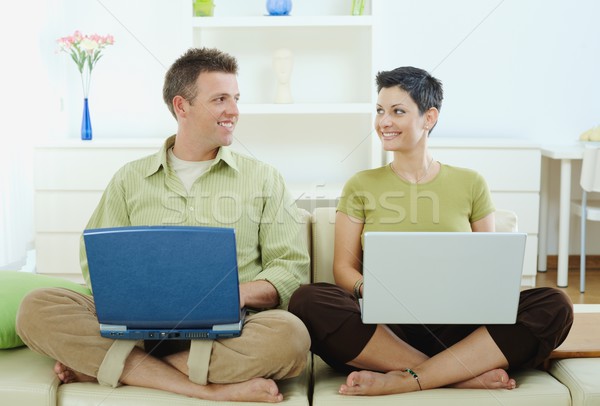 Happy couple using computer Stock photo © nyul