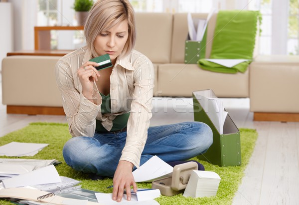 Worried woman checking documents Stock photo © nyul