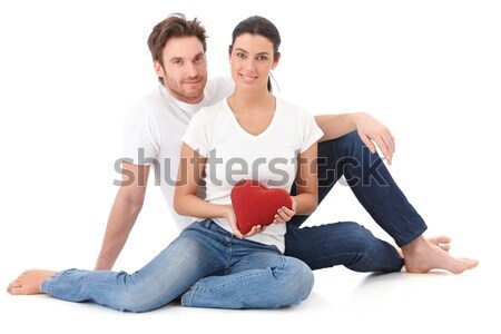 Attractive loving couple sitting on floor smiling Stock photo © nyul