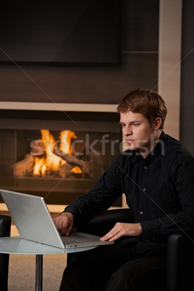 Man using computer at home Stock photo © nyul