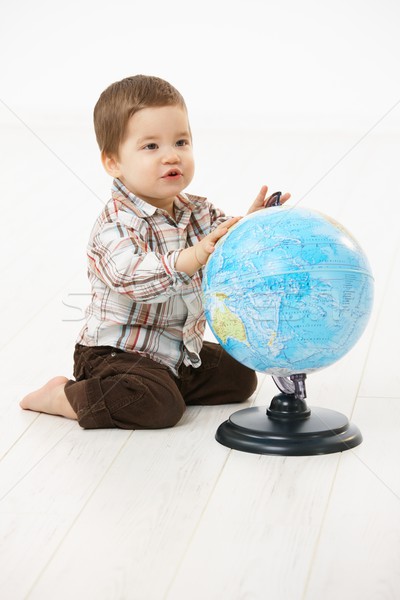 Little boy playing with globe Stock photo © nyul