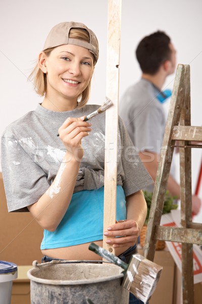 Stockfoto: Portret · glimlachende · vrouw · schilderij · werken · vriendje