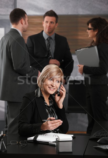 Stockfoto: Zakenvrouw · telefoon · gelukkig · jonge · vergadering