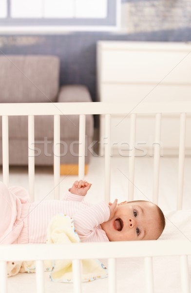 Cute baby girl in crib Stock photo © nyul