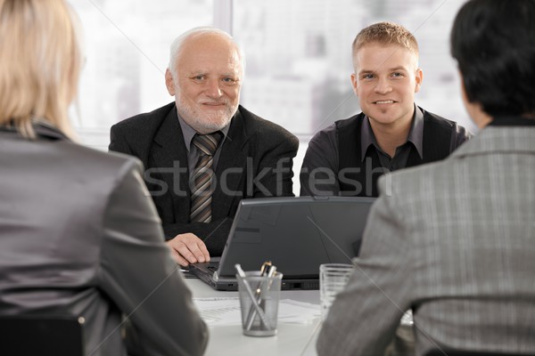 Businessmen meeting with businesswomen Stock photo © nyul