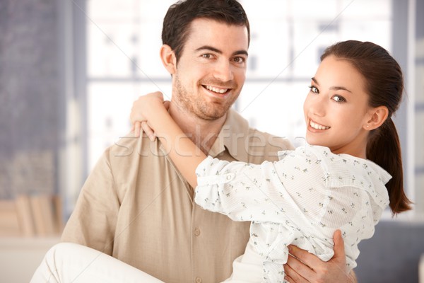 Young couple smiling happily holding each other Stock photo © nyul
