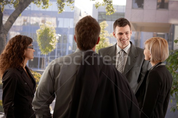 Gens d'affaires parler extérieur groupe jeunes immeuble de bureaux [[stock_photo]] © nyul