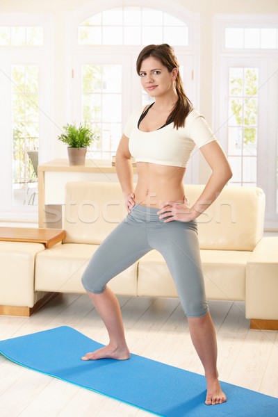 Sporty girl at home Stock photo © nyul