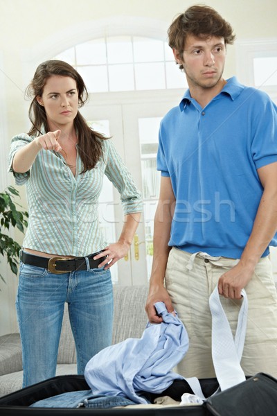 Stockfoto: Paar · vechten · ongelukkig · vrouw · wijzend · uit