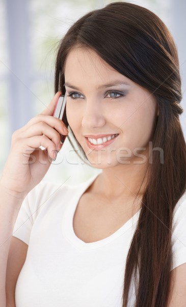 Portrait of beautiful woman on mobile smiling Stock photo © nyul