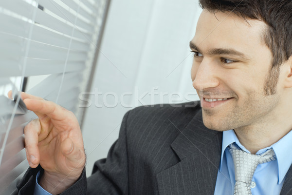 Businessman looking out the window Stock photo © nyul