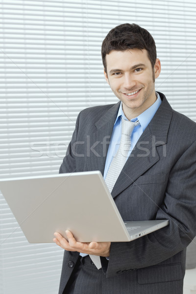 Stock photo: Businessman with laptop