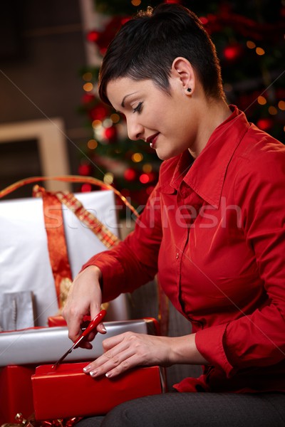 Young woman wrapping christmas gifts Stock photo © nyul