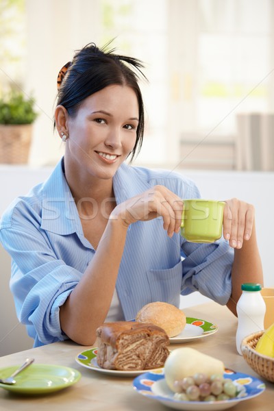 Cheerful young woman having breakfast Stock photo © nyul