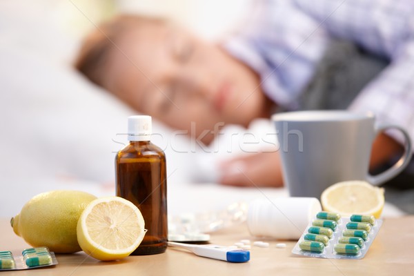 Vitamins medicines for flu woman in background Stock photo © nyul
