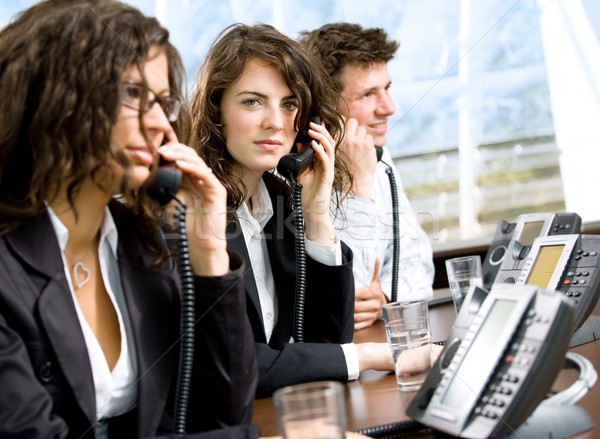 [[stock_photo]]: Service · clients · jeunes · heureux · séance · rangée · appelant