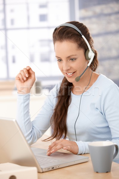 Attractive customer servicer working in office Stock photo © nyul