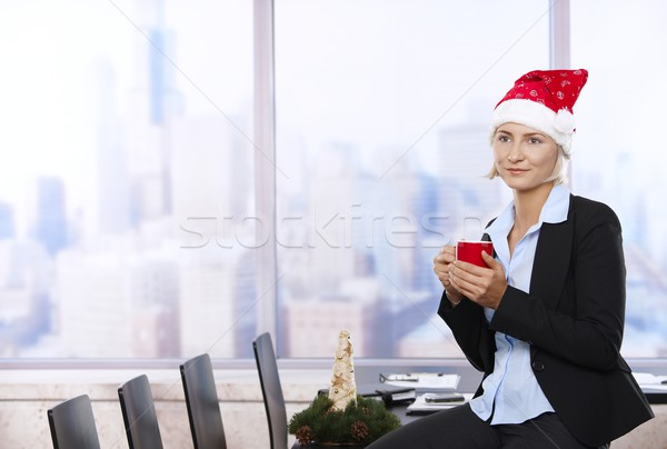 Businesswoman in Santa Claus hat Stock photo © nyul