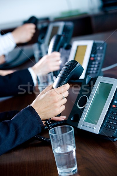 Hands holding phones Stock photo © nyul