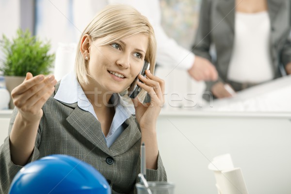 Businesswoman on phone in office Stock photo © nyul