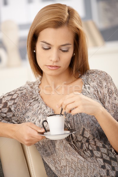 Woman having coffee on couch Stock photo © nyul