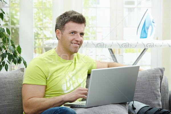 Man using laptop Stock photo © nyul