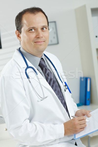Arzt lächelnd medizinischen Büro männlichen Arzt Stock foto © nyul