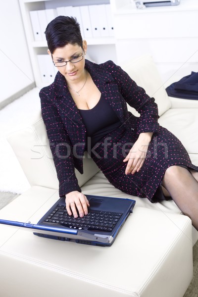 деловая женщина ноутбука сидят диван служба Сток-фото © nyul