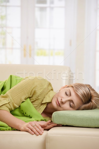 Sarışın kadın uyku kanepe battaniye oturma odası Stok fotoğraf © nyul