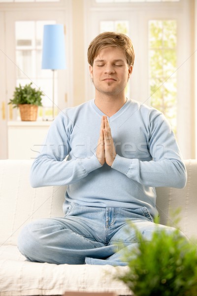 Stock photo: Young man meditating