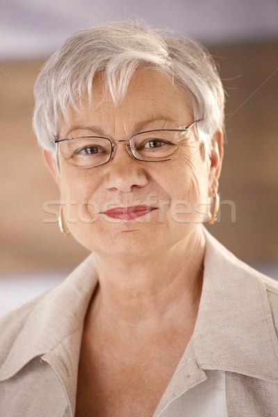 Stock photo: Portrait of senior woman wearing glasses