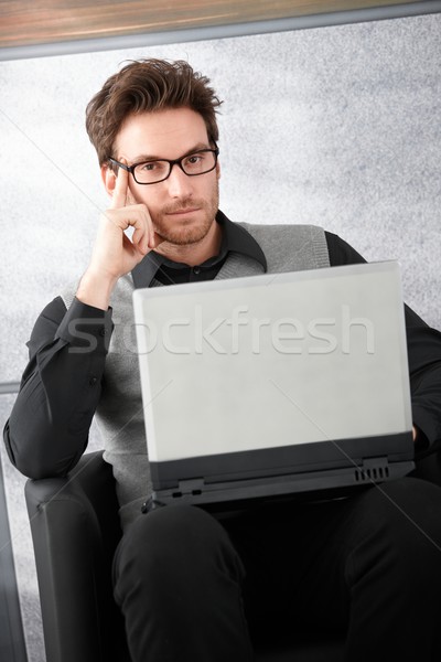 Goodlooking businessman with laptop Stock photo © nyul