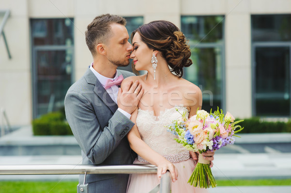 Feliz recém-casados beijando ao ar livre noiva noivo Foto stock © O_Lypa