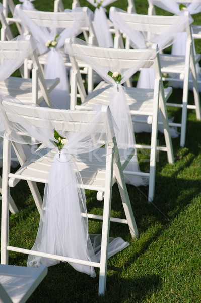 White decorated chairs on a green lawn Stock photo © O_Lypa