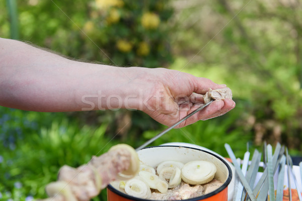 [[stock_photo]]: Homme · viande · brochette · cuisson · barbecue · fond