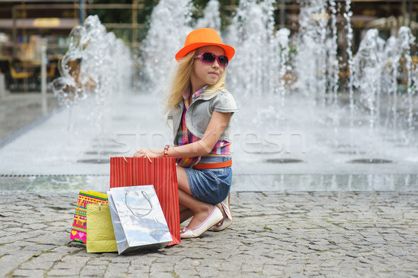 Stock photo: Child with full shopping bags.