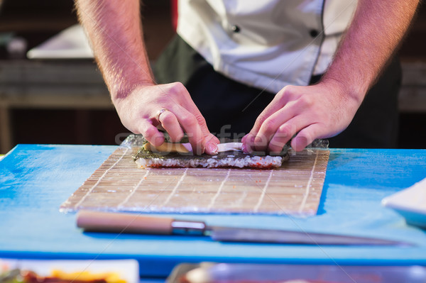 Male cooks preparing sushi Stock photo © O_Lypa